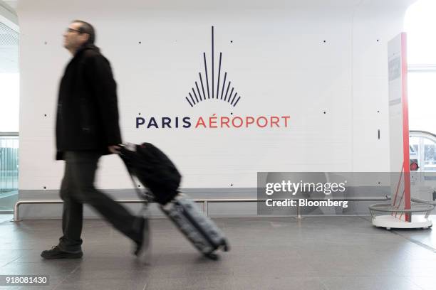 An Aeroports de Paris sign hangs on the wall inside Charles de Gaulle airport, operated by Aeroports de Paris, in Paris, France, on Monday, Feb. 12,...