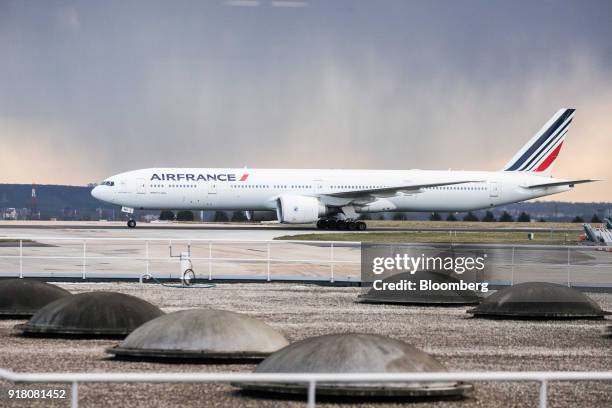 An Air France passenger aircraft, operated by Air France-KLM Group, taxis on the runway at Charles de Gaulle airport, operated by Aeroports de Paris,...