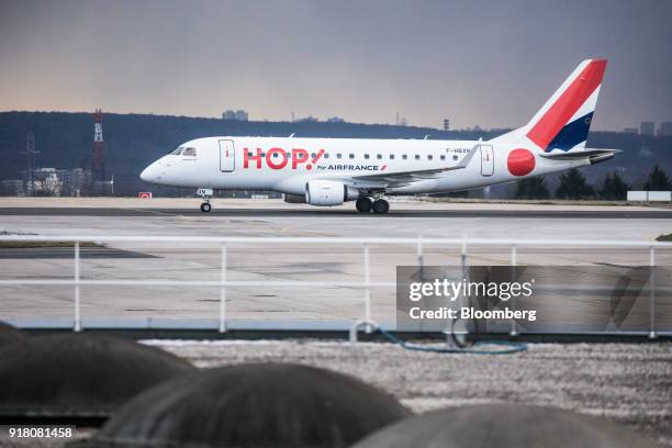 Hop! passenger aircraft, operated by Air France-KLM Group, taxis on the runway at Charles de Gaulle airport, operated by Aeroports de Paris, in...