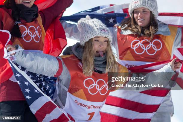 Gold medalist Chloe Kim of the United States celebrates her gold medal win with bronze medalist Arielle Gold of the United States and silver medalist...