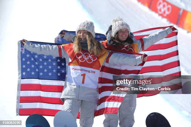 Gold medalist Chloe Kim of the United States celebrates her gold medal win at the presentation with bronze medalist Arielle Gold of the United States...