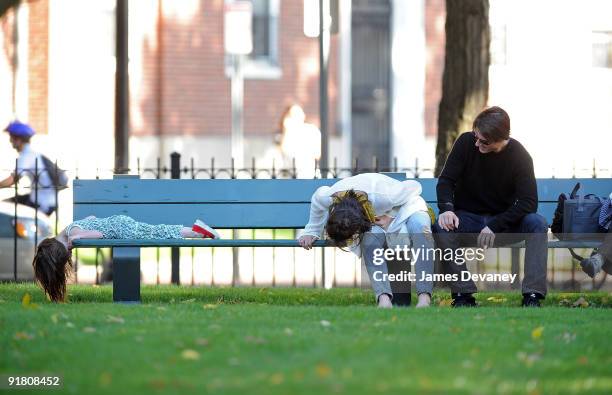 Suri Cruise, Katie Holmes and Tom Cruise visit Charles River Basin on October 10, 2009 in Cambridge, Massachusetts.