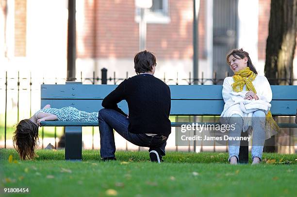 Suri Cruise, Katie Holmes and Tom Cruise visit Charles River Basin on October 10, 2009 in Cambridge, Massachusetts.