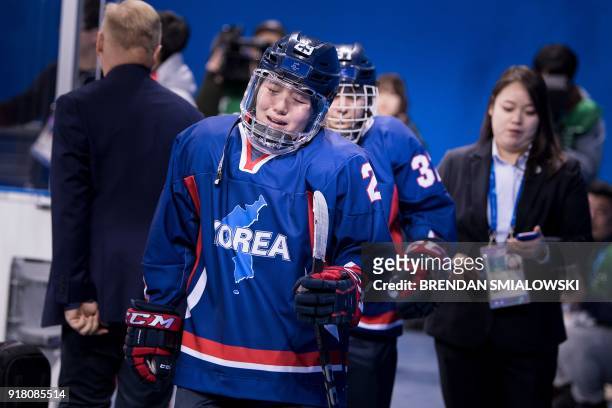 Unified Korea's Lee Jingyu reacts after her teams defeat in the women's preliminary round ice hockey match between Japan and the Unified Korean team...