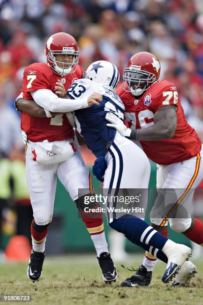 Matt Cassel of the Kansas City Chiefs is hit while throwing a pass by Anthony Spencer of the Dallas Cowboys at Arrowhead Stadium on October 11, 2009...