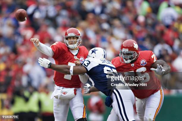 Matt Cassel of the Kansas City Chiefs is hit while throwing a pass by Anthony Spencer of the Dallas Cowboys at Arrowhead Stadium on October 11, 2009...