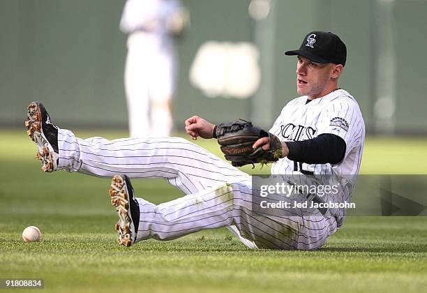 Clint Barmes of the Colorado Rockies can't come up with the ball on a single by Carlos Ruiz of the Philadelphia Phillies in the top of the second...