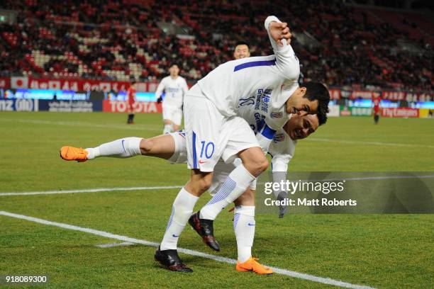 Giovanni Moreno of Shanghai Shenhua celebrates scoring the opening goal with his team mate Cao Yunding during the AFC Champions League Group H match...