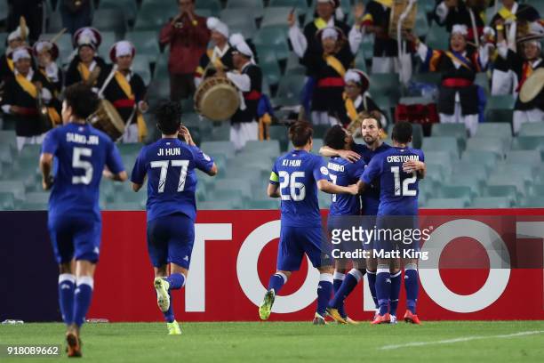 Dejan Damjanovic of the Bluewings celebrates with team mates after scoring the first goal during the AFC Asian Champions League match between Sydney...