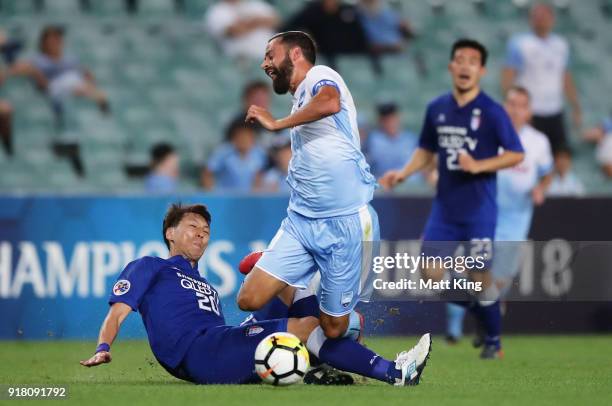 Alex Brosque of Sydney FC is tackled by Kwak Kwang-Seon of the Bluewings during the AFC Asian Champions League match between Sydney FC and Suwon...