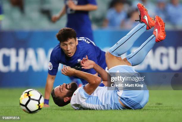 Alex Brosque of Sydney FC is tackled by Kwak Kwang-Seon of the Bluewings during the AFC Asian Champions League match between Sydney FC and Suwon...