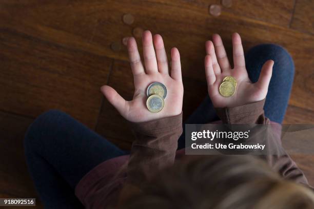 Bonn, Germany Five-year old girl shows her pocket money on February 03, 2018 in Bonn, Germany.