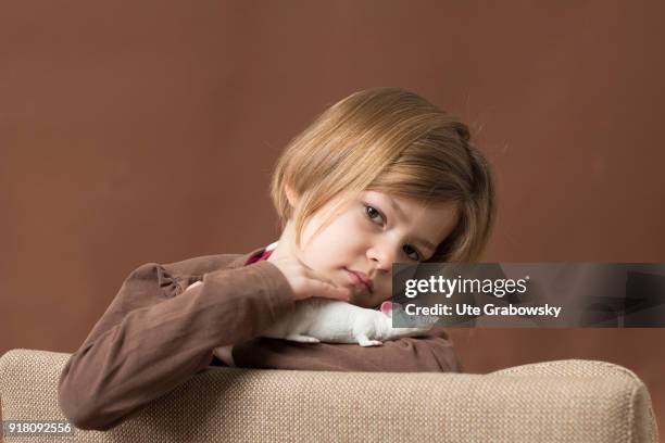 Bonn, Germany Five-year old girl poses with a plastic rat on February 03, 2018 in Bonn, Germany.