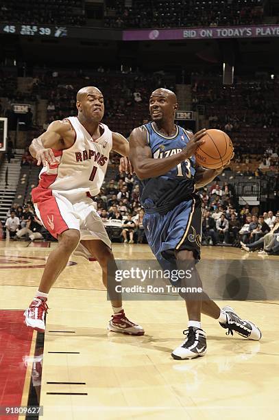 Mike James of the Washington Wizards moves the ball against Jarrett Jack of the Toronto Raptors during the preseason game on October 11, 2009 at the...