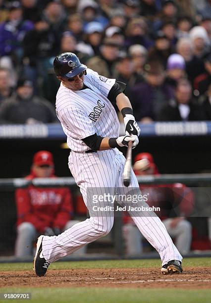 Troy Tulowitzki of the Colorado Rockies hits a RBI double against the Philadelphia Phillies in the bottom of the sixth inning in Game Four of the...
