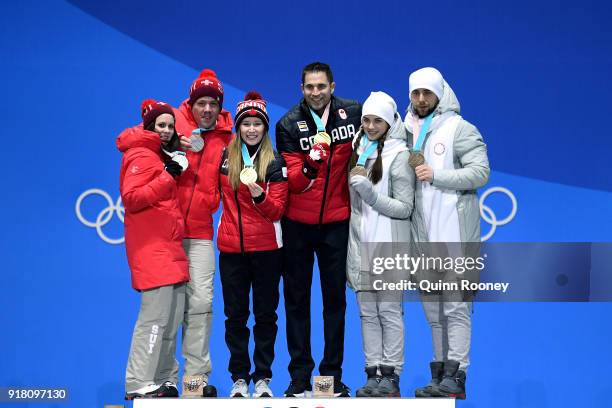 Silver medalists Jenny Perret and Martin Rios of Switzerland, gold medalists Kaitlyn Lawes and John Morris of Canada, and bronze medalists Anastasia...