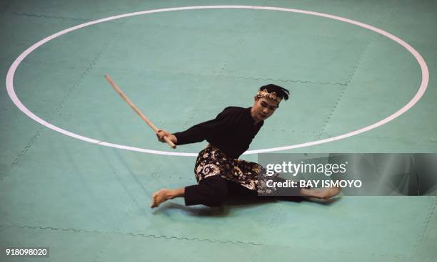 Souksavanh Chanthilath of Laos performs during men's single final of Asian Games 2018 test event in Jakarta on February 14, 2018. / AFP PHOTO / BAY...