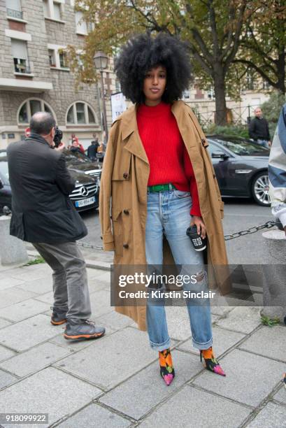 Fashion Editor of Wonderland magazine Julia Sarr Jamois wears a Balenciaga coat and boots and Levi's jeans day 6 of Paris Womens Fashion Week...