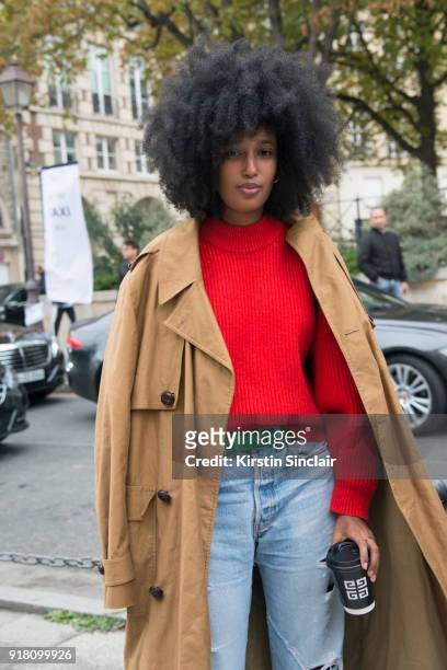 Fashion Editor of Wonderland magazine Julia Sarr Jamois wears a Balenciaga coat and Levi's jeans day 6 of Paris Womens Fashion Week Spring/Summer...