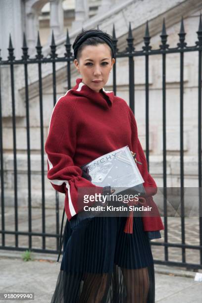 Buying Manager at Selfridges Jeannie Lee wears a Sacai skirt and sweater dress and a Balenciaga bag day 6 of Paris Womens Fashion Week Spring/Summer...