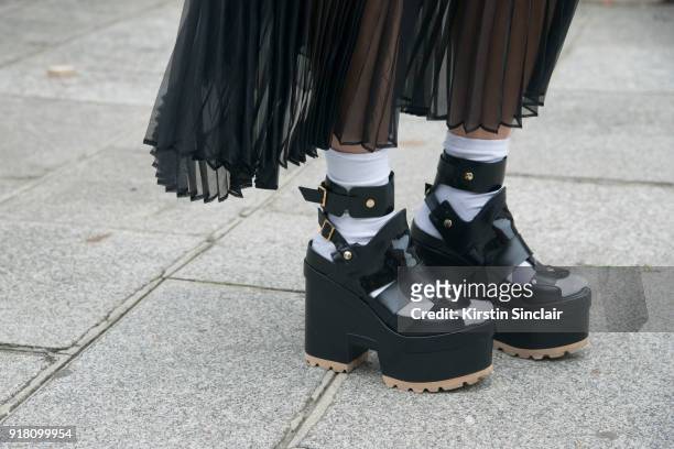 Buying Manager at Selfridges Jeannie Lee wears a Sacai skirt and shoes day 6 of Paris Womens Fashion Week Spring/Summer 2018, on October 1, 2017 in...
