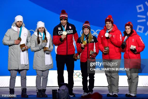 Russia's bronze medallist Aleksandr Krushelnitckii and Anastasia Bryzgalova, Canada's gold medallists John Morris and Kaitlyn Lawes and Switzerland's...