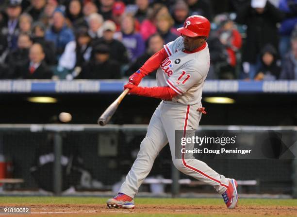 Jimmy Rollins of the Philadelphia Phillies hits a double in the top of the seventh inning against the Colorado Rockies in Game Four of the NLDS...