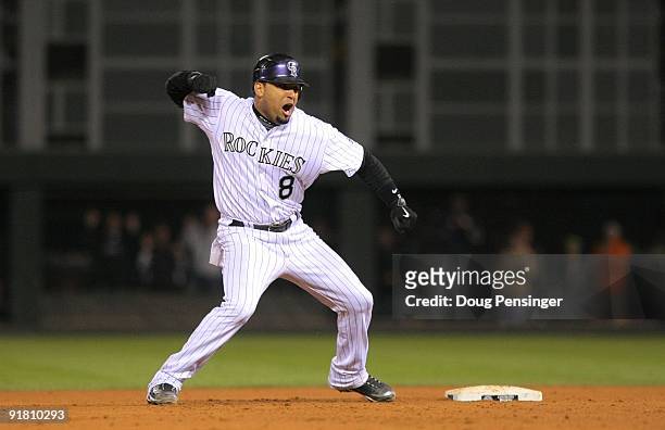 Yorvit Torrealba of the Colorado Rockies reacts after he hit a 2-run double in the bottom of the eighth inning against the Philadelphia Phillies in...