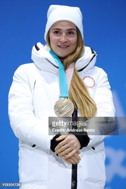 Bronze medalist Yulia Belorukova of Olympic Athlete from Russia poses during the medal ceremony for the Cross-Country Ladies' Sprint Classic on day...
