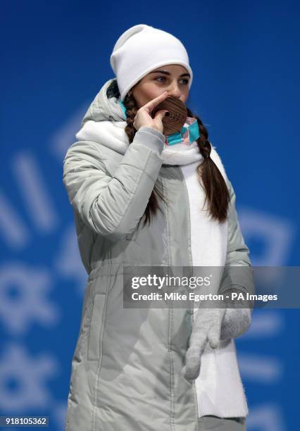 Russian athlete Anastasia Bryzgalova receives her Bronze medal for Mixed Doubles Curling during the medal ceremony at the Medal Plaza during day five...