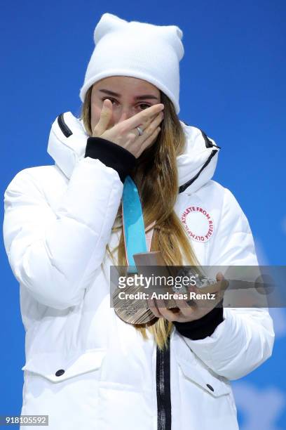 Bronze medalist Yulia Belorukova of Olympic Athlete from Russia reacts during the medal ceremony for the Cross-Country Ladies' Sprint Classic on day...