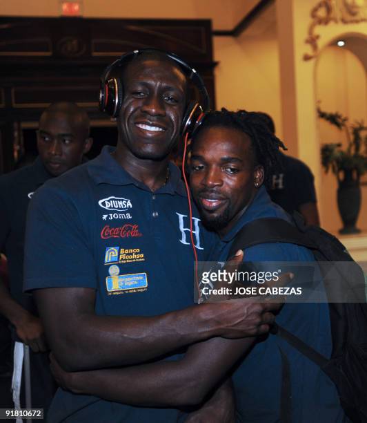 Honduran footballers Hendry Thomas and Walter Martinez pose for a picture upon arrival to San Salvador, on October 12, 2009. Honduras will face El...