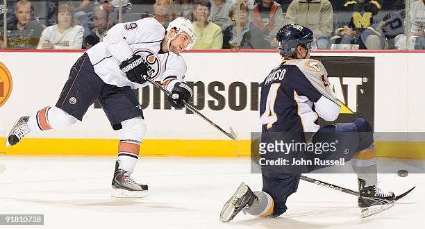 Patrick O'Sullivan of the Edmonton Oilers fires a shot passed Teemu Laakso of the Nashville Predators on October 12, 2009 at the Sommet Center in...