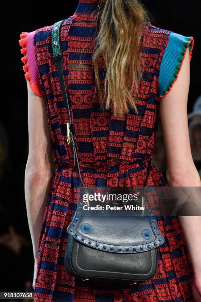 Model, bag detail, walks the runway at the Vivienne Tam show during New York Fashion Week at Gallery I at Spring Studios on February 13, 2018 in New...