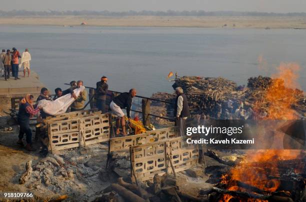 Bodies are laid on pyres before being cremated in Manikarnika Ghat on January 28, 2018 in Varanasi, India. Manikarnika Ghat is one of the holiest...