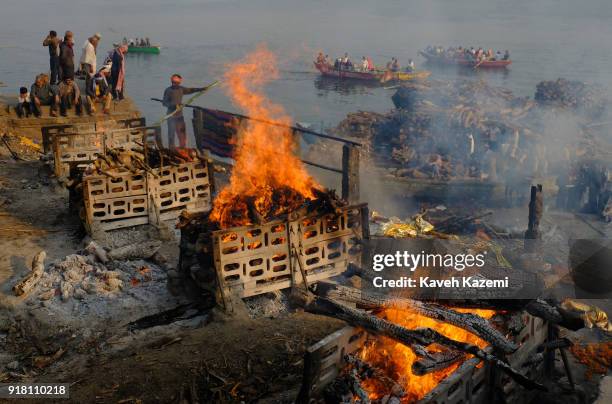 Burning pyres seen during cremation ceremonies in Manikarnika Ghat on January 28, 2018 in Varanasi, India. Manikarnika Ghat is one of the holiest...