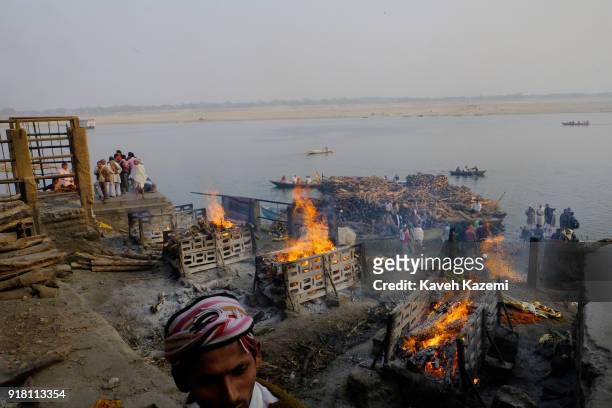 Burning pyres seen during cremation ceremonies in Manikarnika Ghat on January 28, 2018 in Varanasi, India. Manikarnika Ghat is one of the holiest...