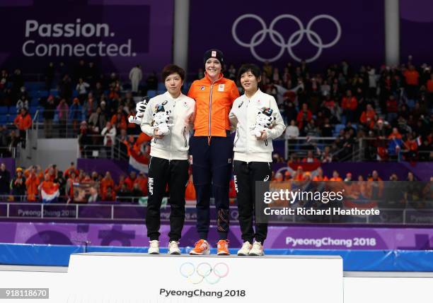 Jorien Ter Mors of the Netherlands celebrates winning the gold medal with silver medallist Nao Kodaira of Japan and bronze medallist Miho Takagi of...