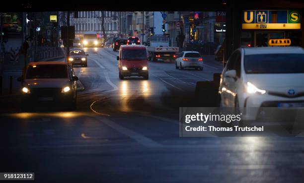 Berlin, Germany Cars drive at dawn on a street in Berlin Neukoelln on February 14, 2018 in Berlin, Germany.