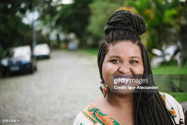 smiling afro young woman - braided stock pictures, royalty-free photos & images