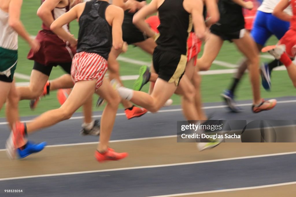 Close-up of runners on a race track
