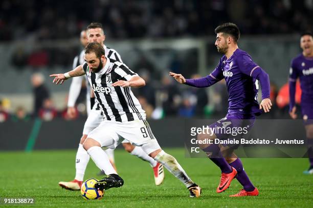 Gonzalo Higuain and Marco Benassi during the serie A match between ACF Fiorentina and Juventus at Stadio Artemio Franchi on February 9, 2018 in...