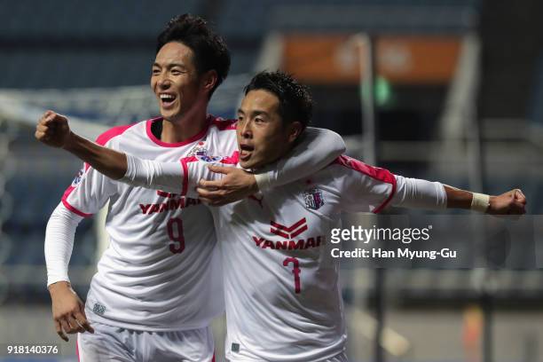 Kota Mizunuma of Cerezo Osaka celebrates scoring the opening goal with his team mate Kenyu Sugimoto during the AFC Champions League Group G match...