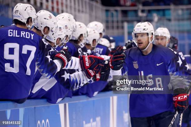 Brian O'Neill of the United States celebrates after scoring a goal on Gasper Kroselj of Slovenia in the first period during the Men's Ice Hockey...