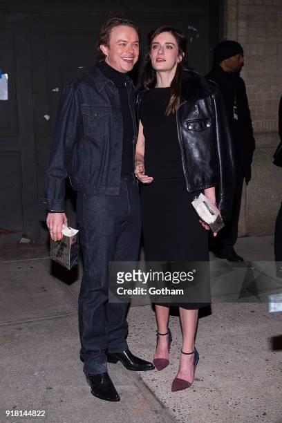 Dane DeHaan and Anna Wood attend the Calvin Klein fashion show during New York Fashion Week at the American Stock Exchange Building on February 13,...