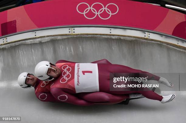 Russia's Aleksandr Denisev and Vladislav Antonov compete in the doubles luge run 1 during the Pyeongchang 2018 Winter Olympic Games at the Olympic...