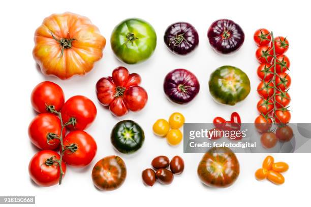 tomatensorten isoliert auf weißem hintergrund - tomatoes stock-fotos und bilder