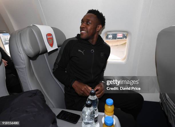 Danny Welbeck of Arsenal boards the plane for the flight to Sweden at Luton Airport on February 14, 2018 in Luton, England.