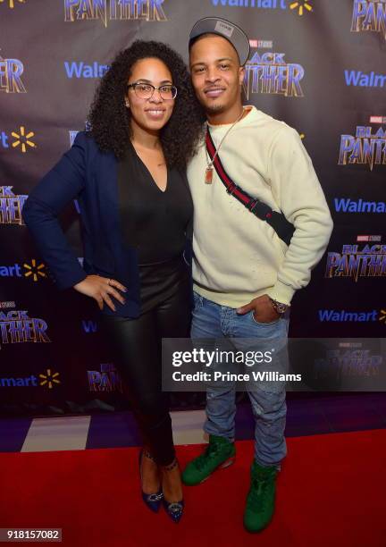 Regina Moore and T.I. Attend "Black Panther" advance Screening at Regal Hollywood on February 13, 2018 in Chamblee, Georgia.