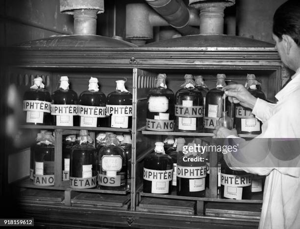 Researcher works in the tetanus and diphteria research laboratory of the Pasteur Institute, 06 November 1938 in Garches. The Pasteur Institute was...